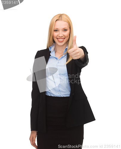 Image of young businesswoman with thumbs up