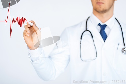 Image of doctor drawing electrocardiogram on virtual screen