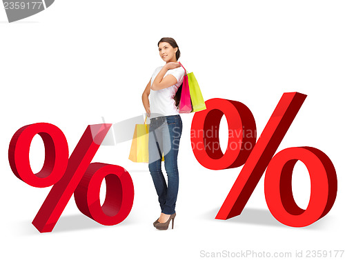 Image of woman with shopping bags and percent signs