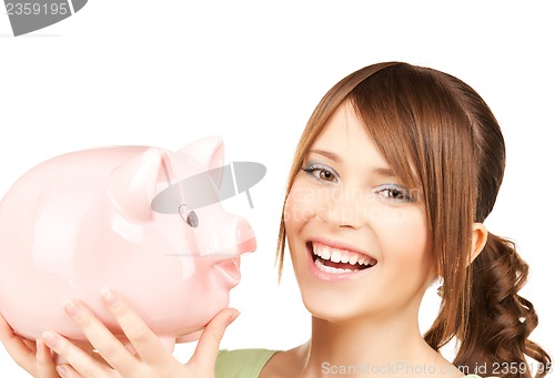 Image of lovely girl with big piggy bank