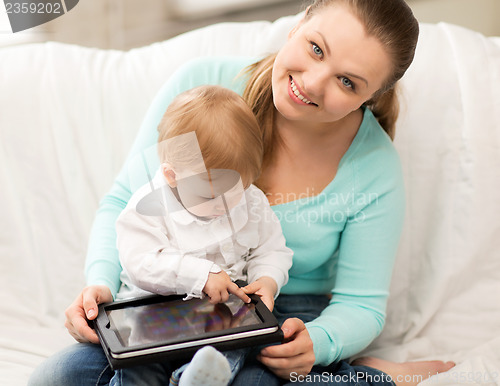 Image of mother and adorable baby with tablet pc