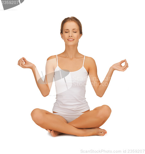 Image of woman in cotton underwear doing yoga