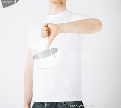 Image of man showing thumbs down