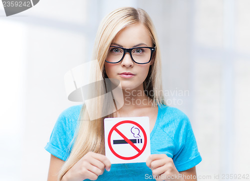 Image of woman with smoking restriction sign