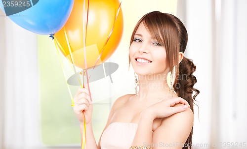 Image of happy teenage girl with balloons