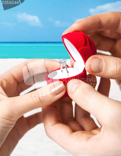 Image of couple with wedding ring and gift box