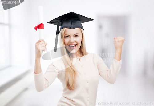 Image of student in graduation cap with certificate