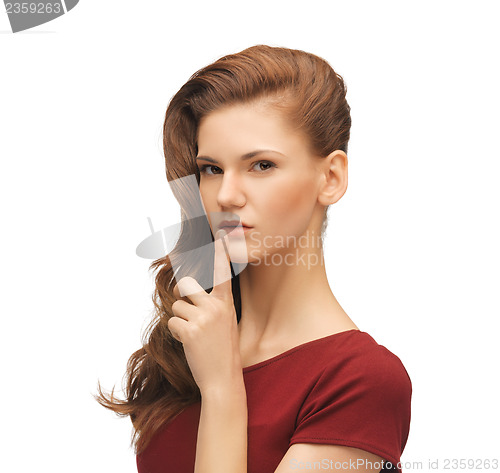 Image of woman with finger on her lips