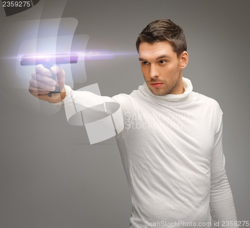 Image of futuristic man with gadget