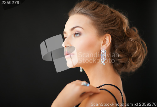Image of woman with diamond earrings