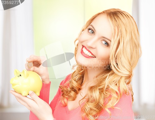 Image of woman with piggy bank and cash money