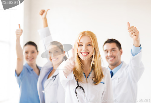 Image of group of doctors showing thumbs up