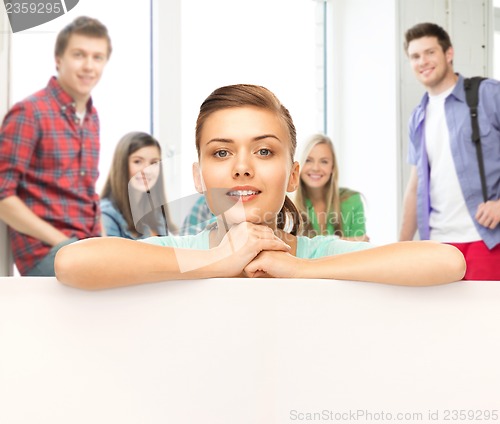 Image of woman with white blank board at school