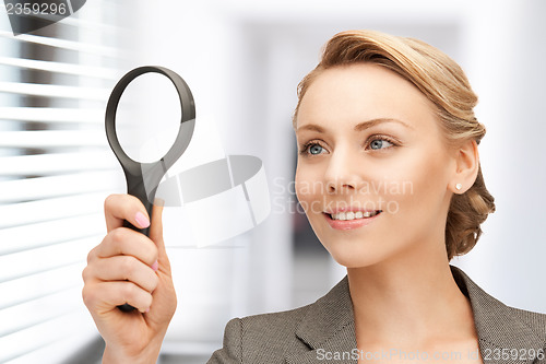 Image of woman with magnifying glass