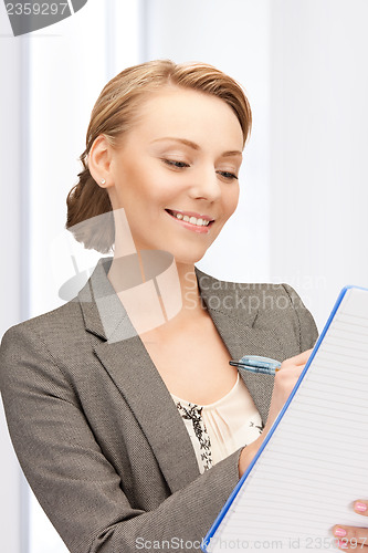 Image of happy woman with big notepad