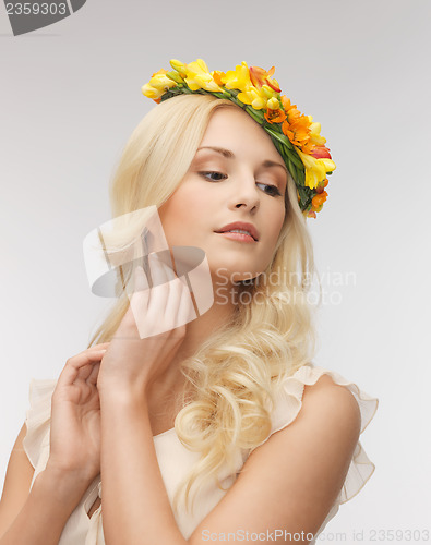 Image of woman wearing wreath of flowers