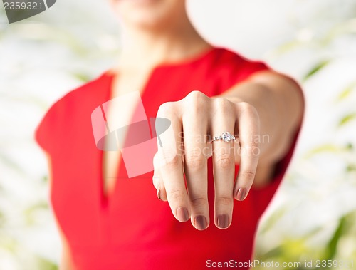 Image of woman showing wedding ring on her hand