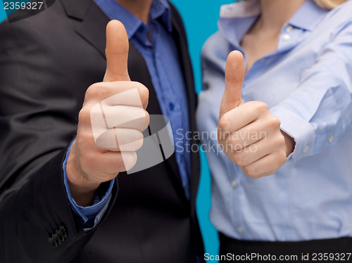 Image of business team showign thumbs up