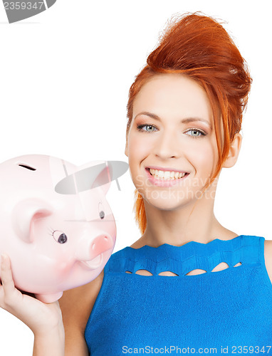 Image of lovely woman with big piggy bank