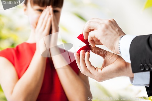 Image of couple with wedding ring and gift box