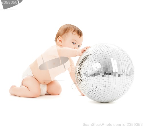 Image of child playing with disco ball