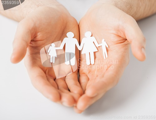 Image of man with family of paper men