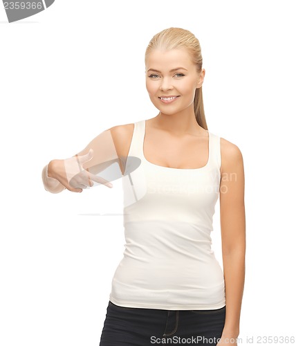 Image of woman in blank white t-shirt pointing at herself