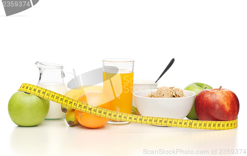 Image of healthy breakfast and measuring tape