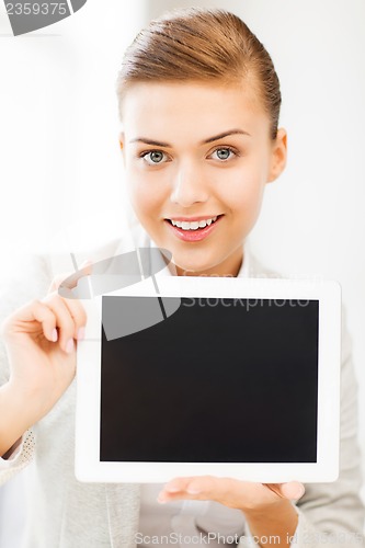 Image of businesswoman with tablet pc in office
