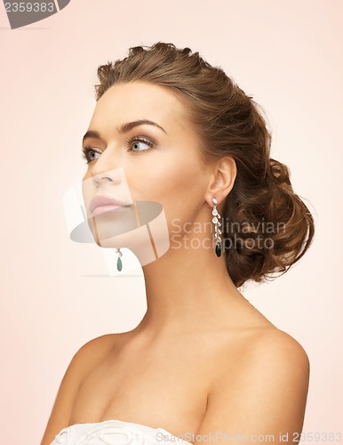 Image of woman with diamond earrings