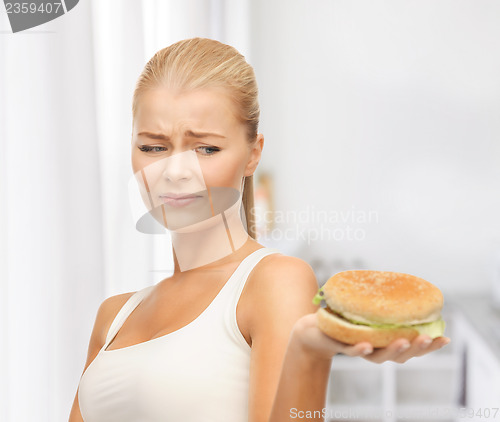 Image of woman rejecting junk food