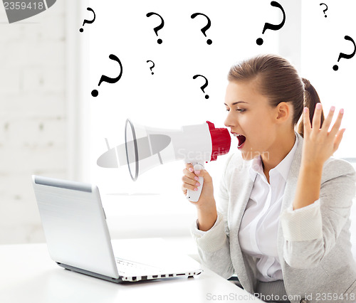 Image of strict businesswoman shouting in megaphone