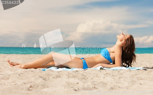 Image of happy woman on the beach