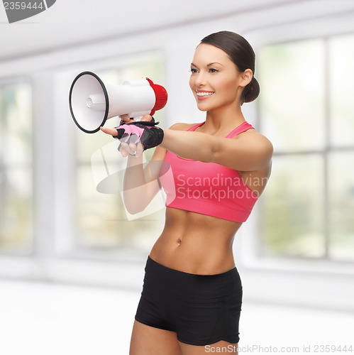 Image of woman with megaphone pointing at something