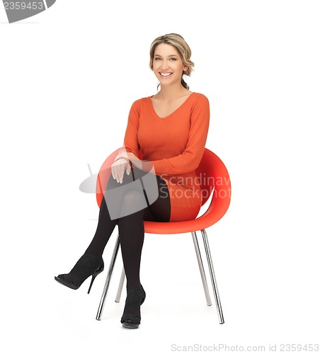 Image of woman sitting on chair