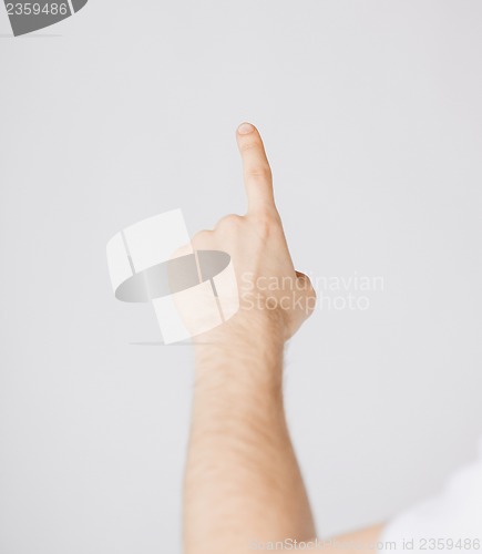 Image of man hand pointing at something