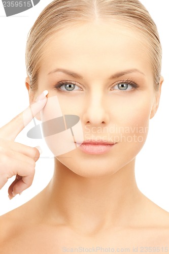 Image of woman pointing at her eye area