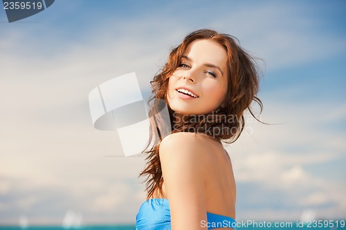 Image of woman in bikini smiling