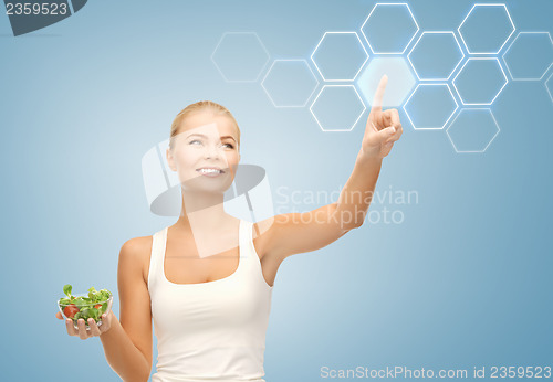 Image of woman with salad and virtual screen