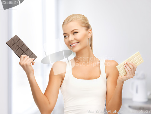 Image of smiling woman with dark and white chocolates