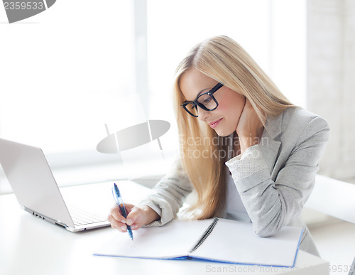 Image of businesswoman with documents