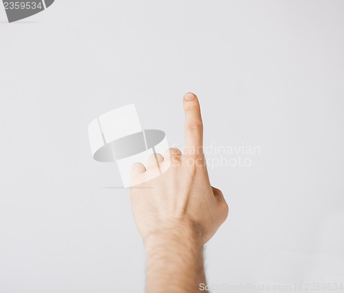 Image of man hand pointing at something