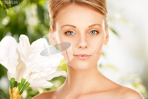 Image of beautiful woman with madonna lily