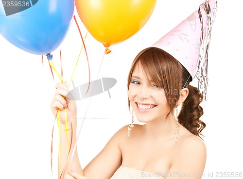 Image of happy girl with colorful balloons