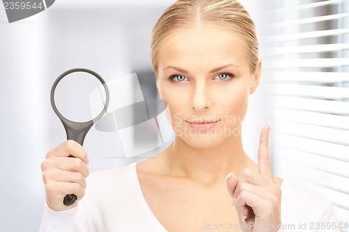 Image of woman with magnifying glass