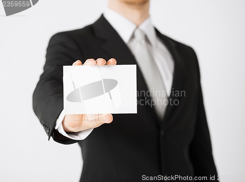 Image of man hand with blank paper