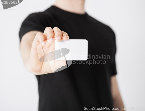 Image of man hand with blank paper