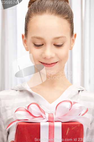 Image of happy teenage girl with gift box