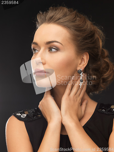 Image of woman with diamond earrings