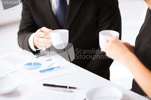 Image of woman hand signing contract paper